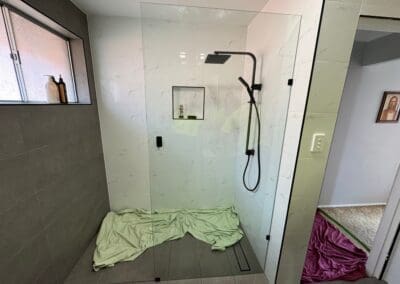 Custom Frameless Shower Screen with Black Fittings